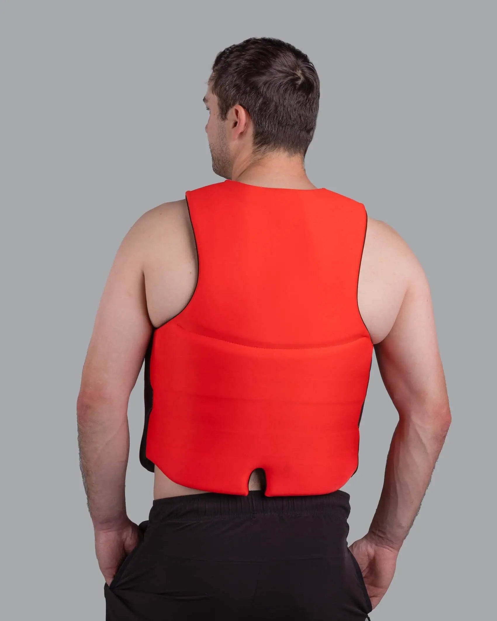 Man wearing a red O'Brien Men's Traditional Vest against a gray background