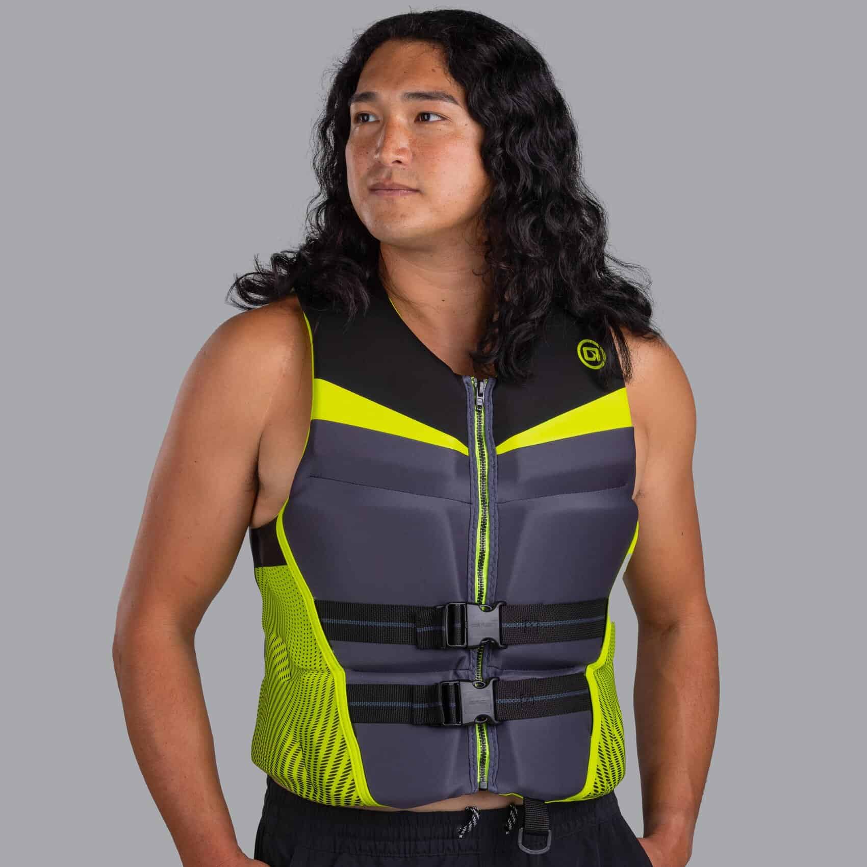 Person wearing a green O'Brien Men's Flex V-Back Life Jacket