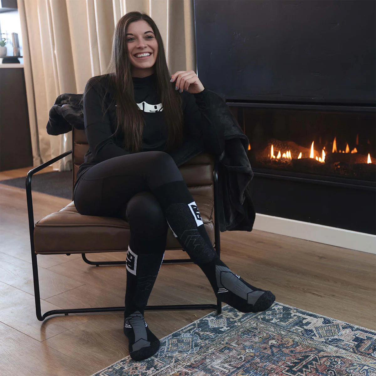 woman wearing the black 509 Women's FZN LVL 1 Base Layer