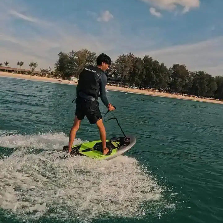 a person riding on the EasyRider Electric Surfboard