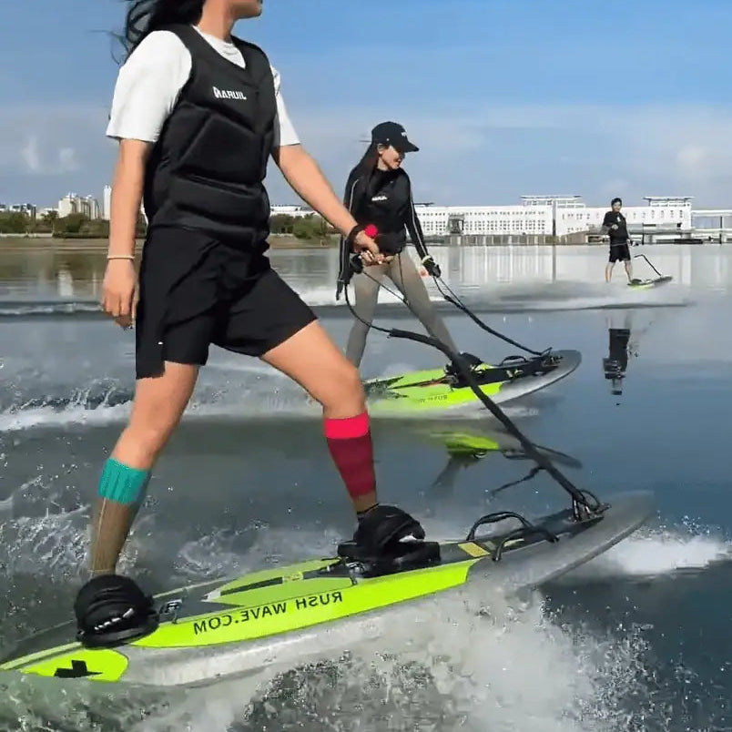 two people riding on the EasyRider Electric Surfboard