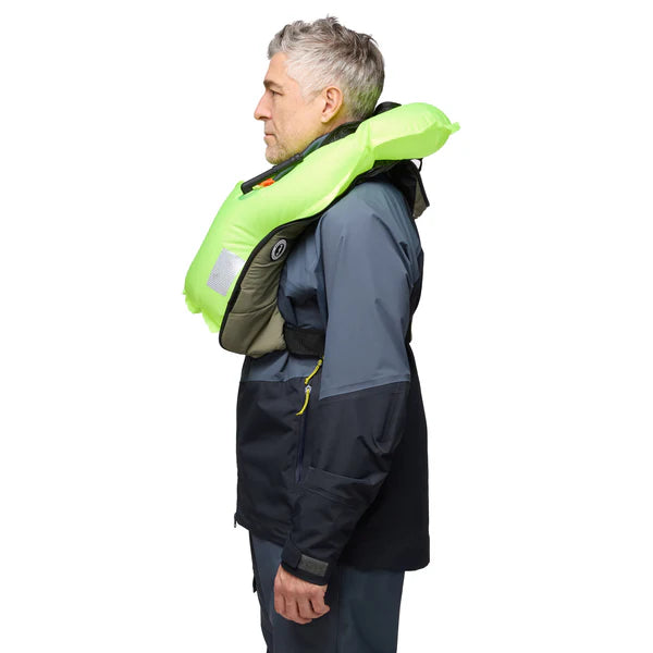 side view of man wearing inflated admiral grey Mustang Survival Elite 120 Inflatable PFD