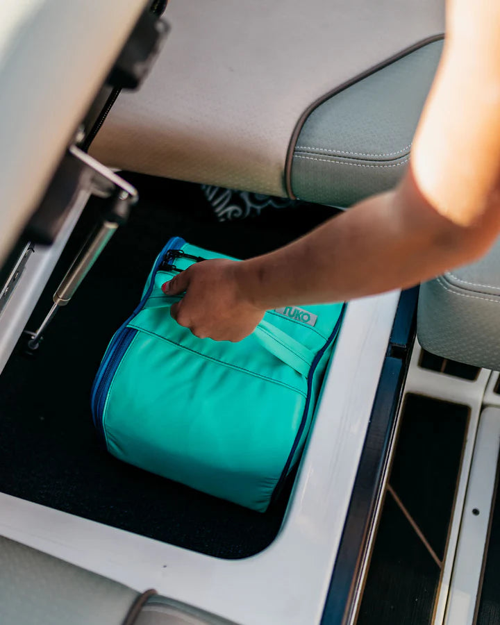 a person is stowing away the Mission Tuko Microfiber Towels (4 Pack)