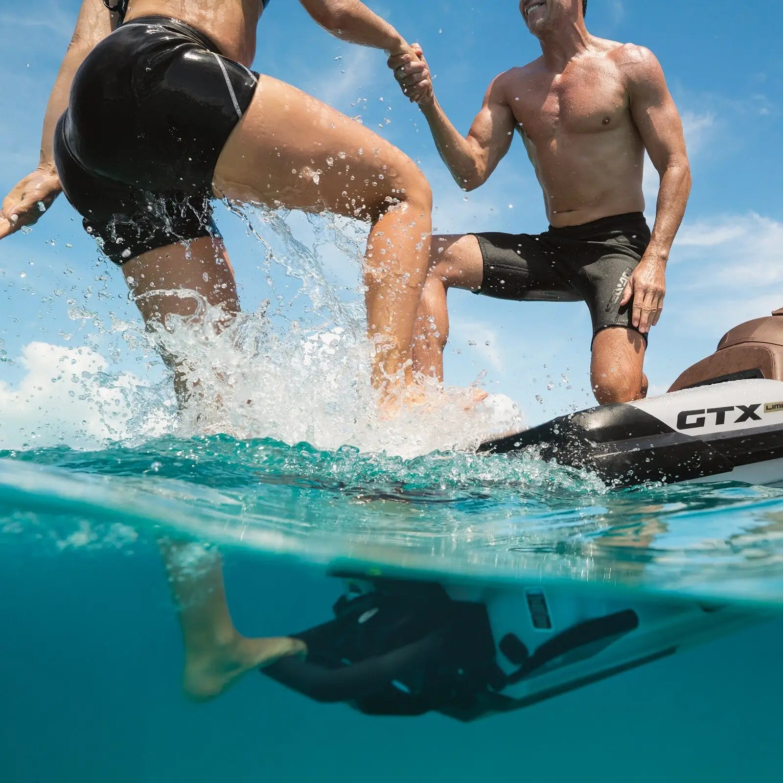 a person steps on the Sea-Doo Boarding Ladder in the water