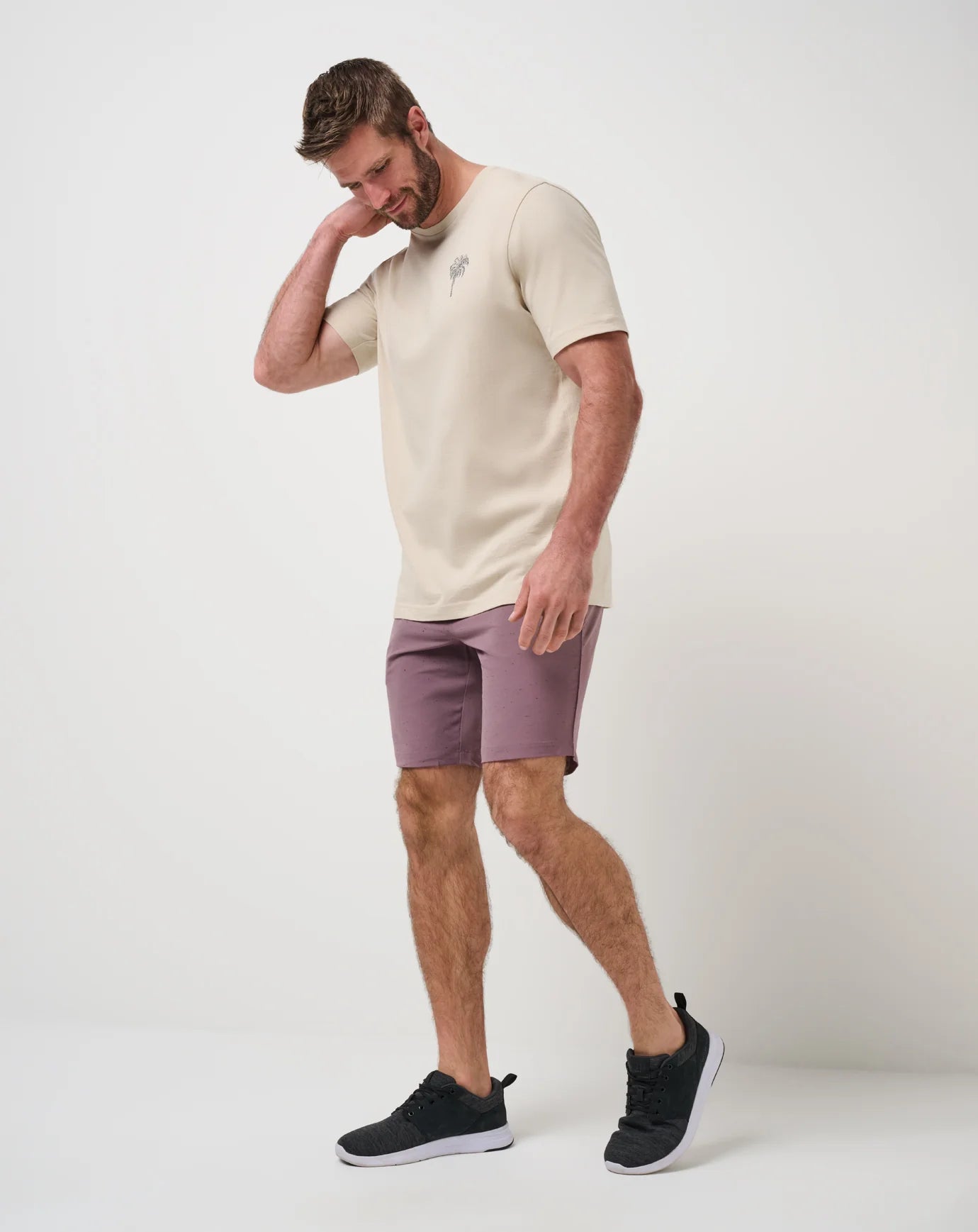 man wearing the TravisMathew Fun Factor Shorts in Moonscape color