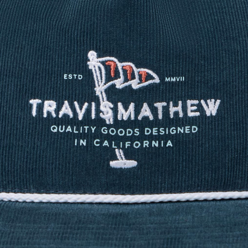 embroidery detail on the TravisMathew "One for the Money" Snapback Hat