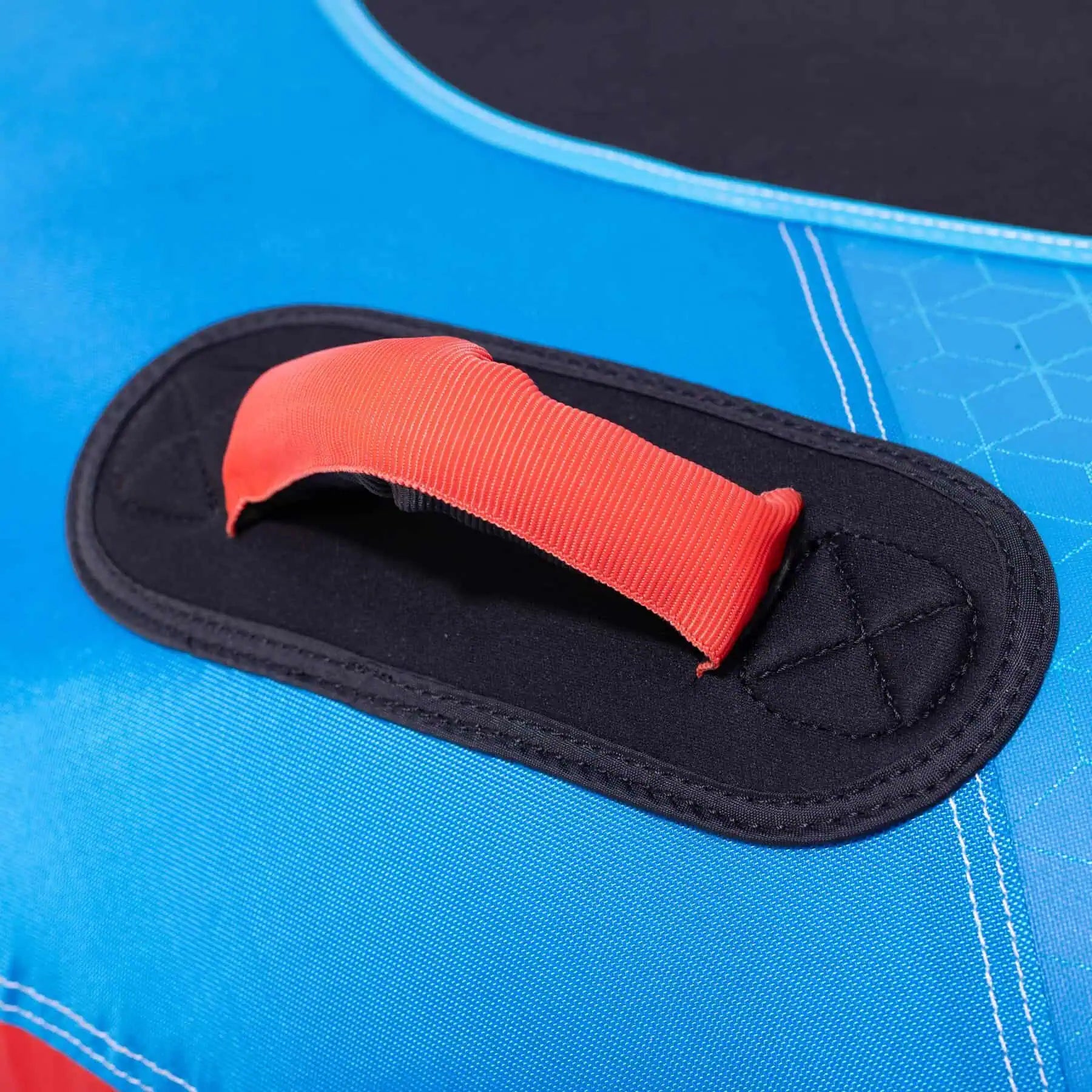 Close-up of a red handle on a blue surface of the O'Brien Screamer Tube