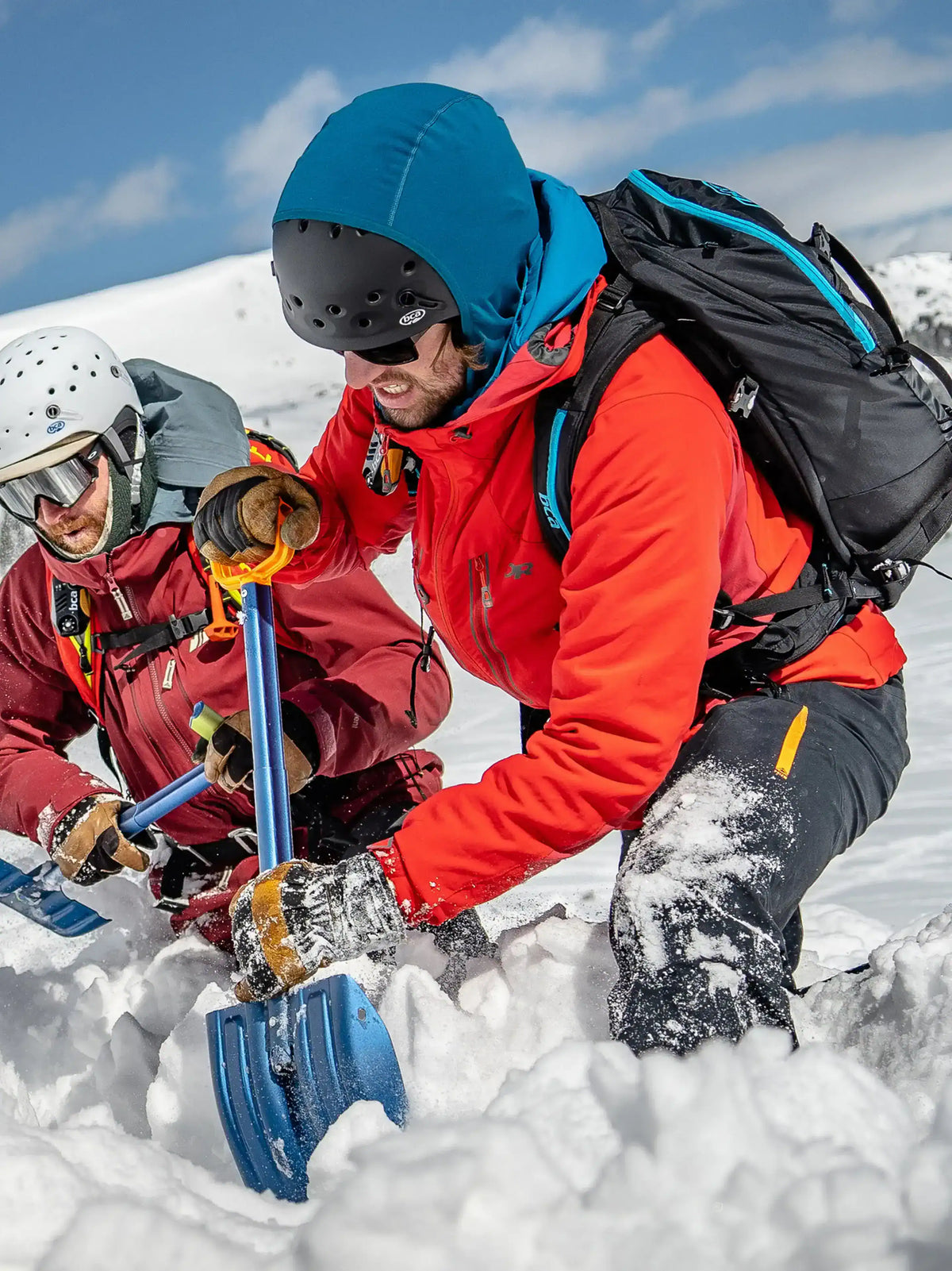 Two people using the BCA Dozer™ 2-D Avalanche Shovel