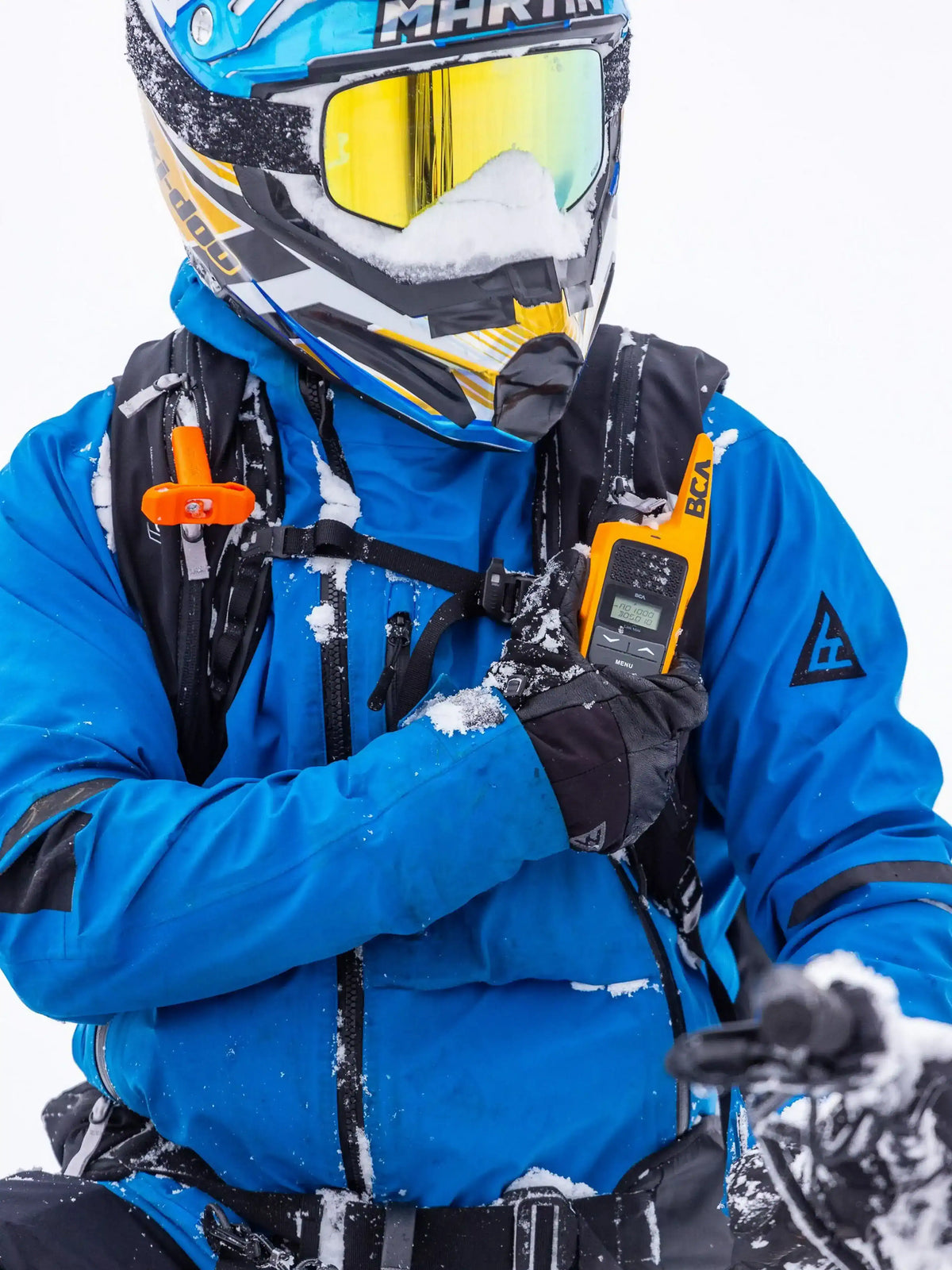 person wearing the BCA Float E2-25 Turbo Avalanche Airbag with additional transceiver