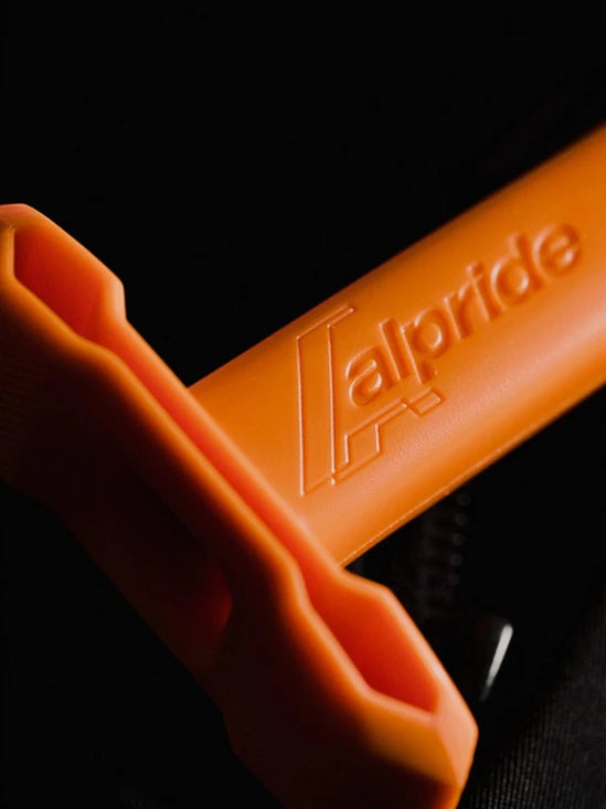 detail of the orange handle on the BCA Float E2 MtnPro Vest Avalanche Airbag
