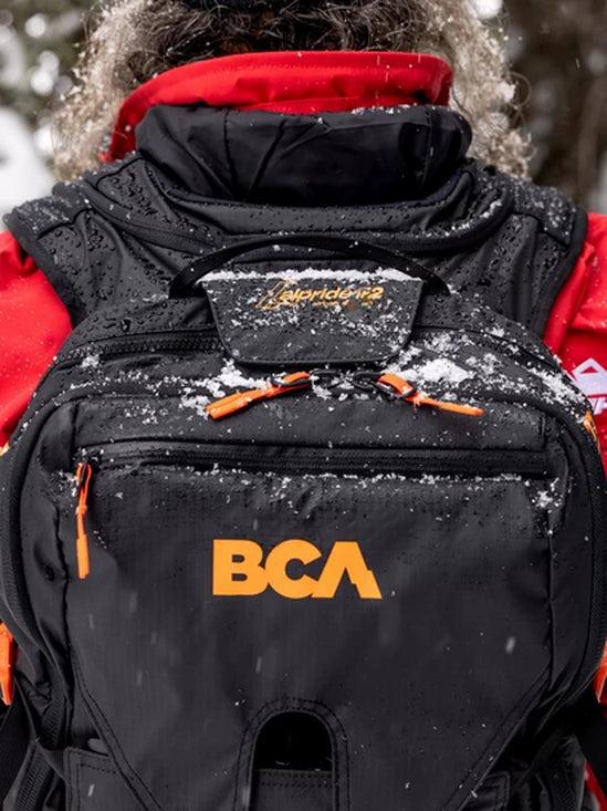 back view of a person wearing the BCA Float E2 MtnPro Vest Avalanche Airbag
