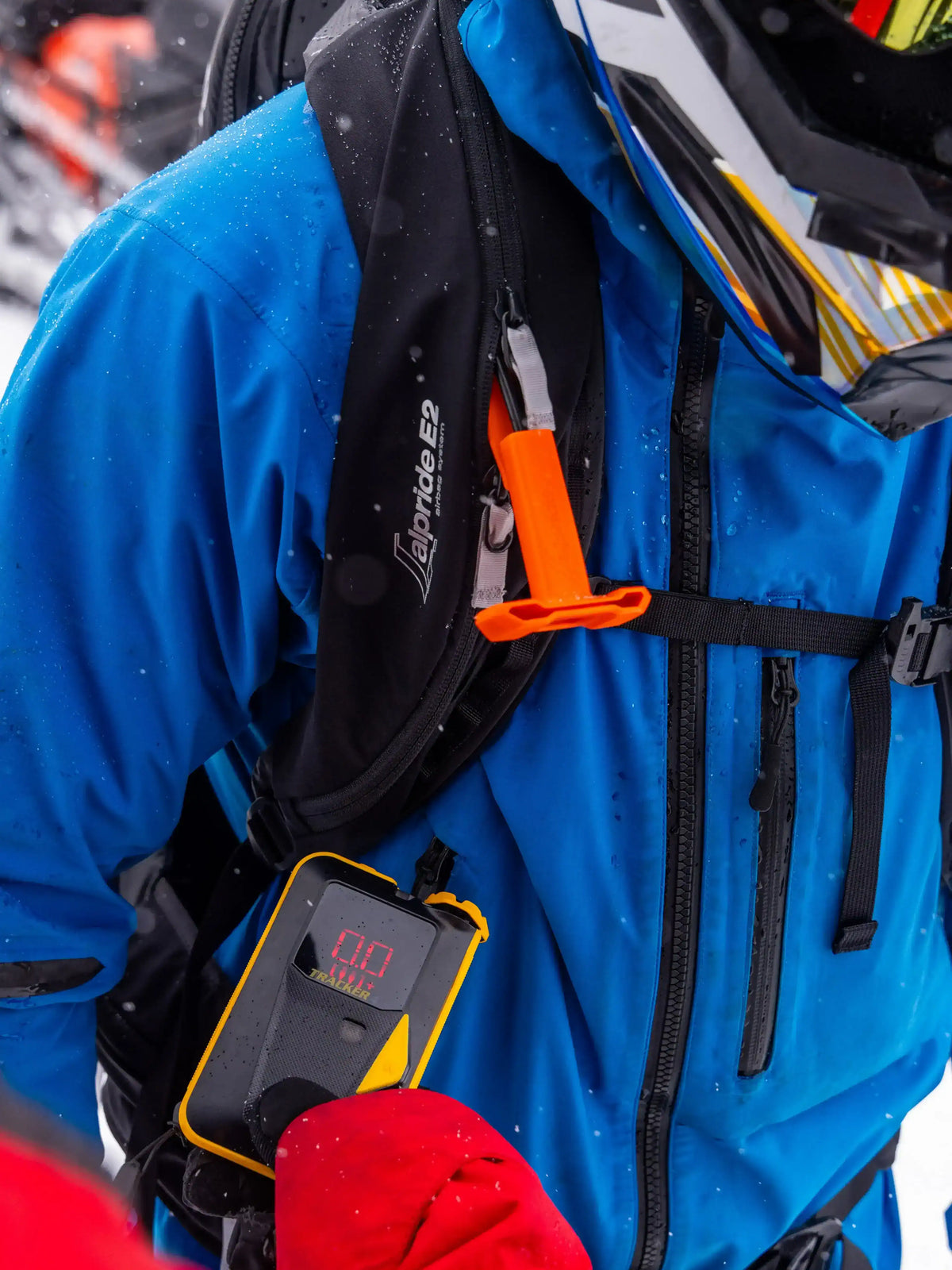 the BCA Tracker4 Avalanche Transceiver hanging from a coat