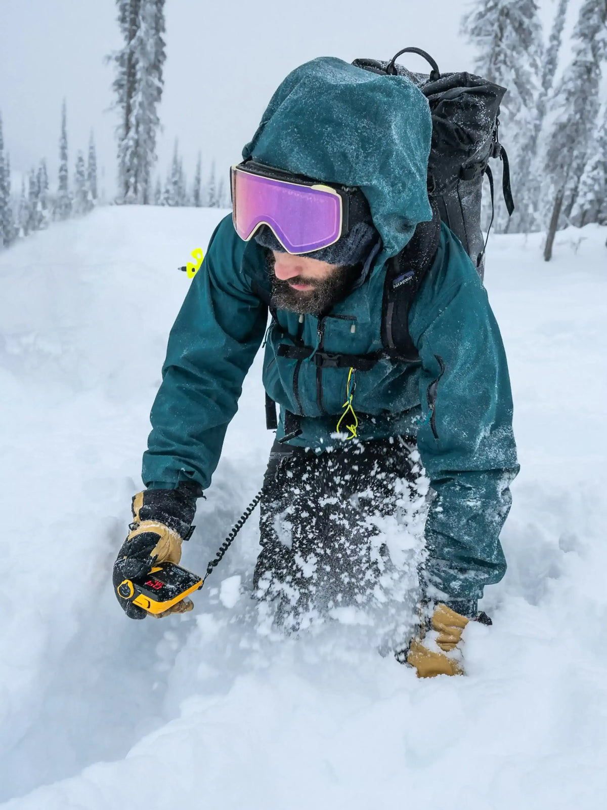 a person using the BCA Tracker4 Avalanche Transceiver in the snow