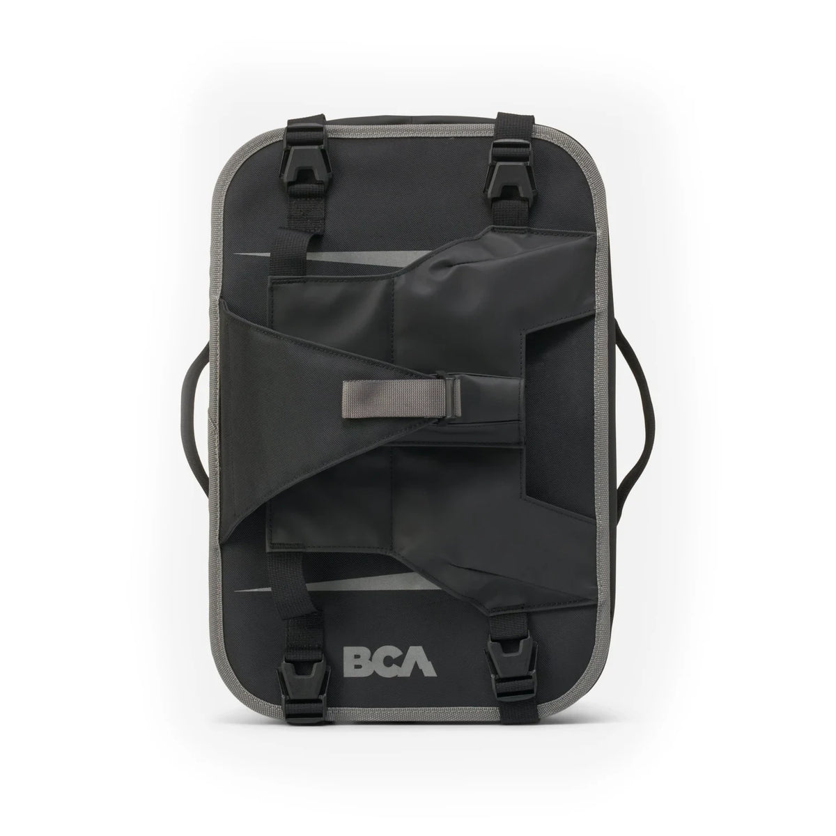 A BCA MtnPro Shorty Tunnel Bag with multiple straps, buckles, and a central strap closure, featuring the BCA logo on the bottom, shown against a plain white background.