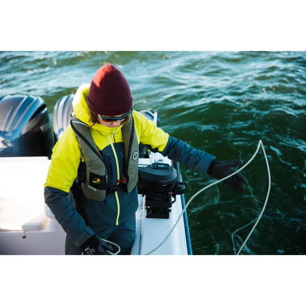 a person is on a boat wearing a Mustang Survival Elite 120 Inflatable PFD