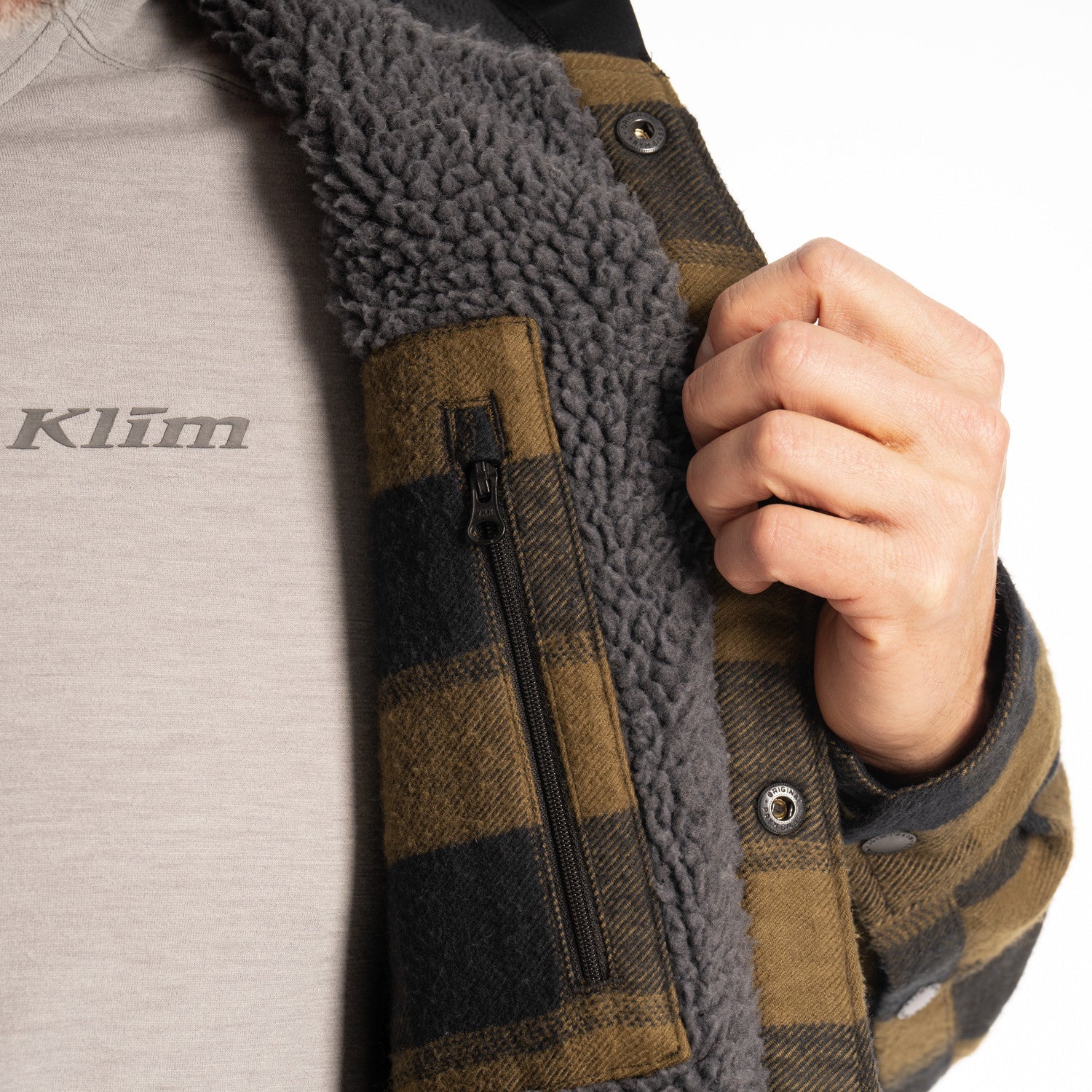 pocket and sherpa lining detail of Klim Targhee Fleece Lined Flannel Hoodie