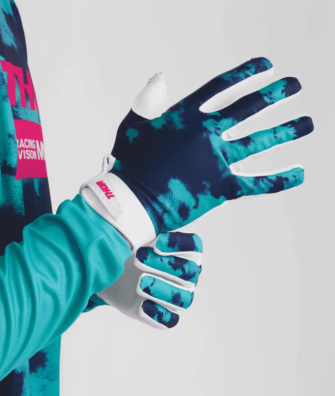 putting on the bleach white/aqua Thor Launchmode Gloves