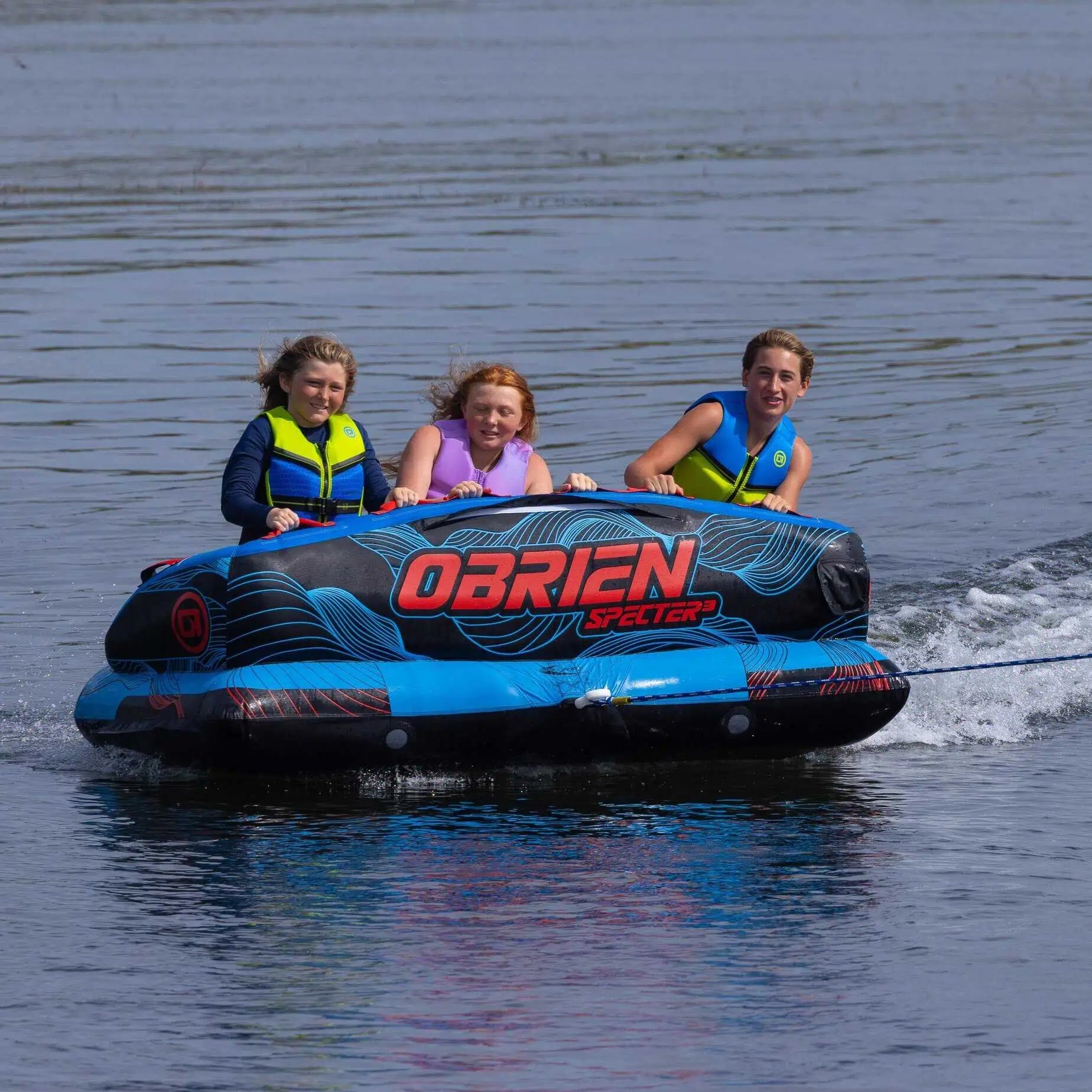Three people on O'Brien Specter 3 Boat Tube in the water