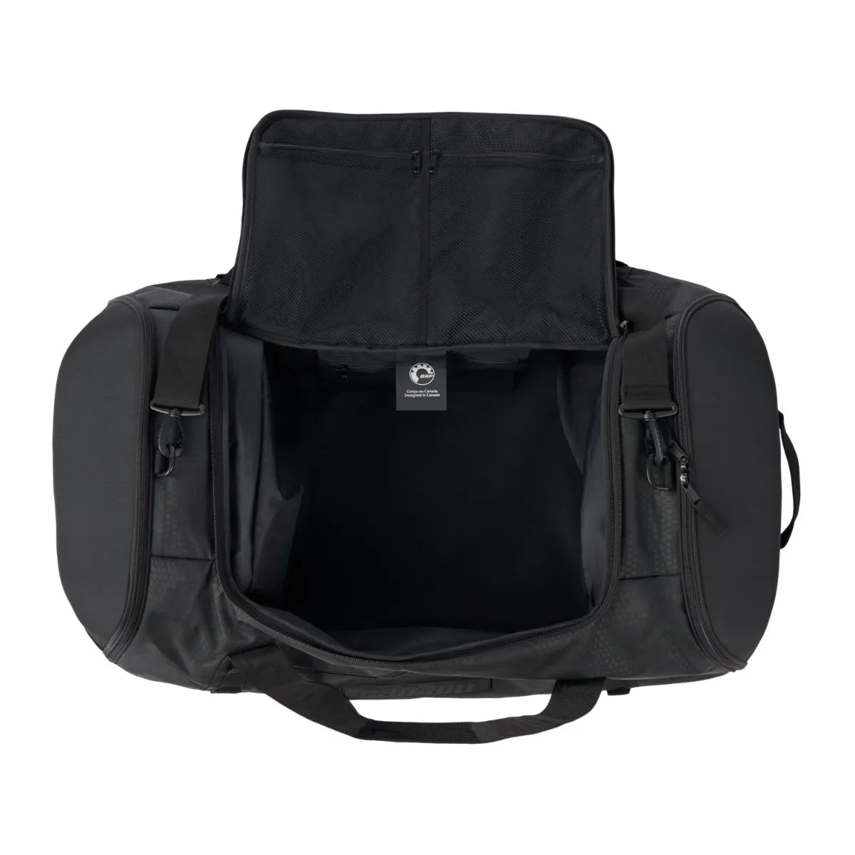 A black Ski-Doo Duffle Bag - 90L / 24 US Gallons shown open from the front, displaying its spacious interior, side pockets, and top handle against a plain white background.