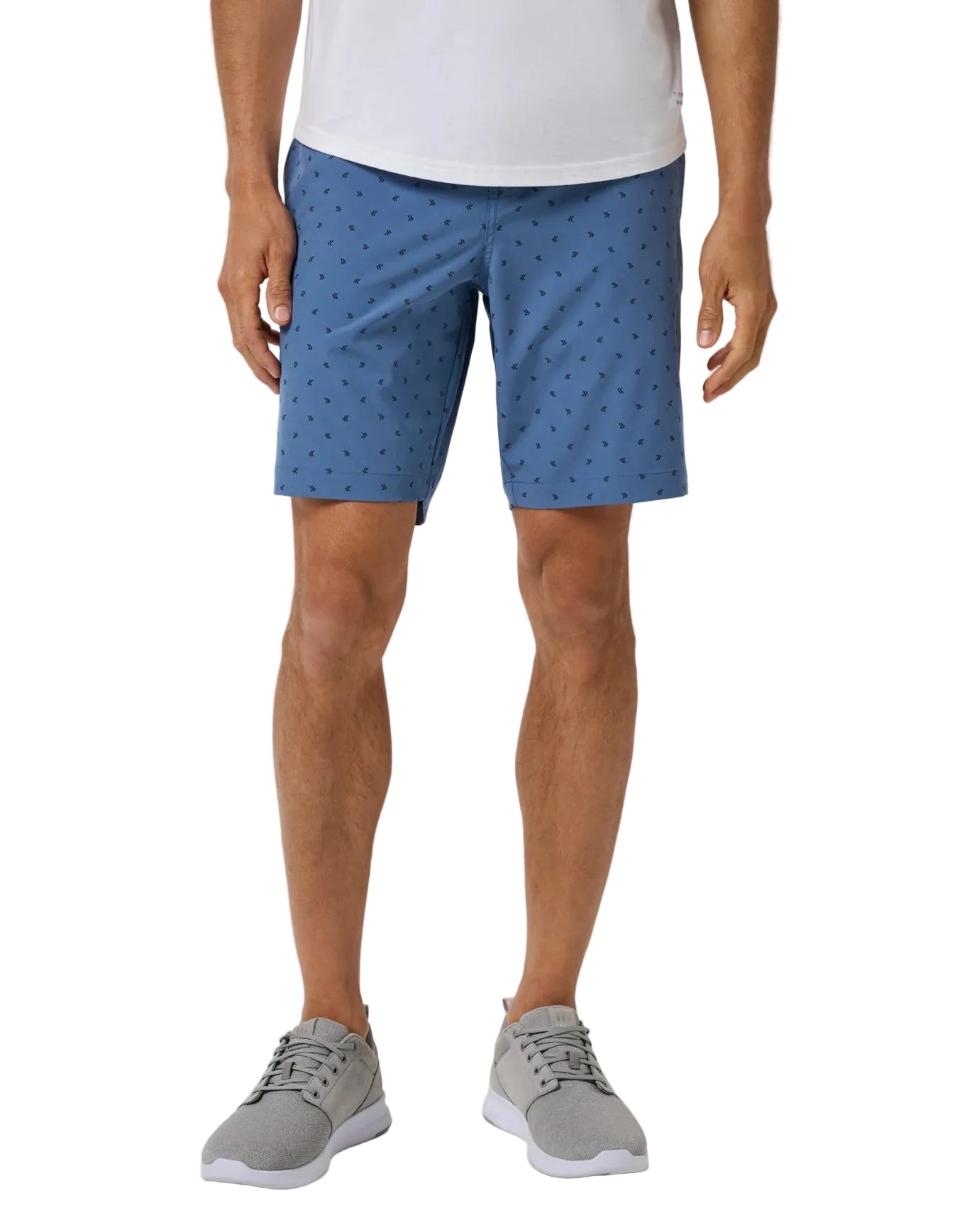 a man wearing the TravisMathew Beck Print Shorts in blue print