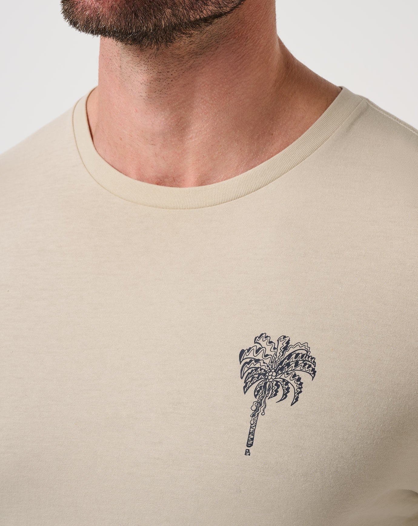 palm tree detail on the chest of the TravisMathew Club Member T-Shirt