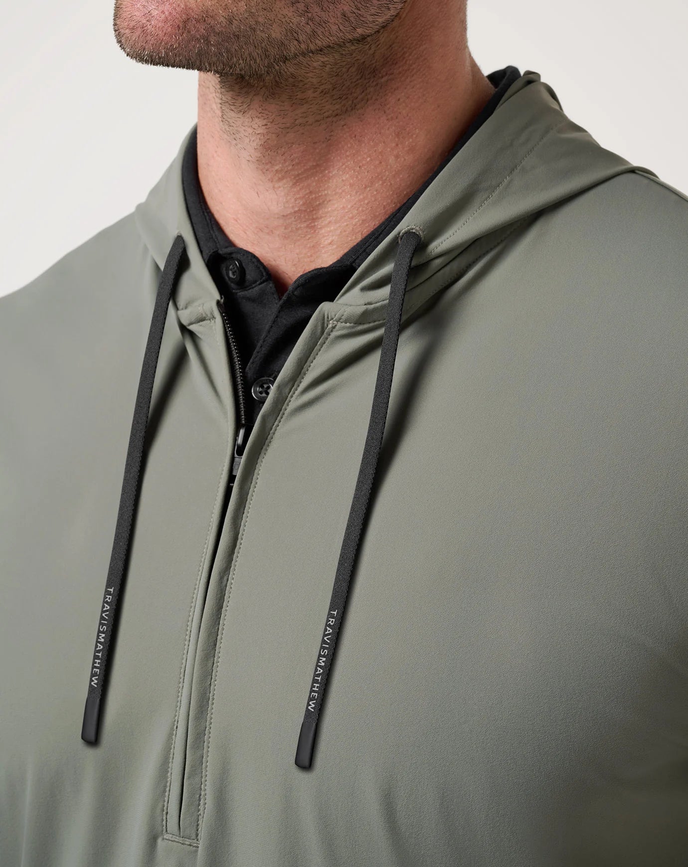 drawstring detail on "dark olive" TravisMathew Hero Hour Tech Hoodie 