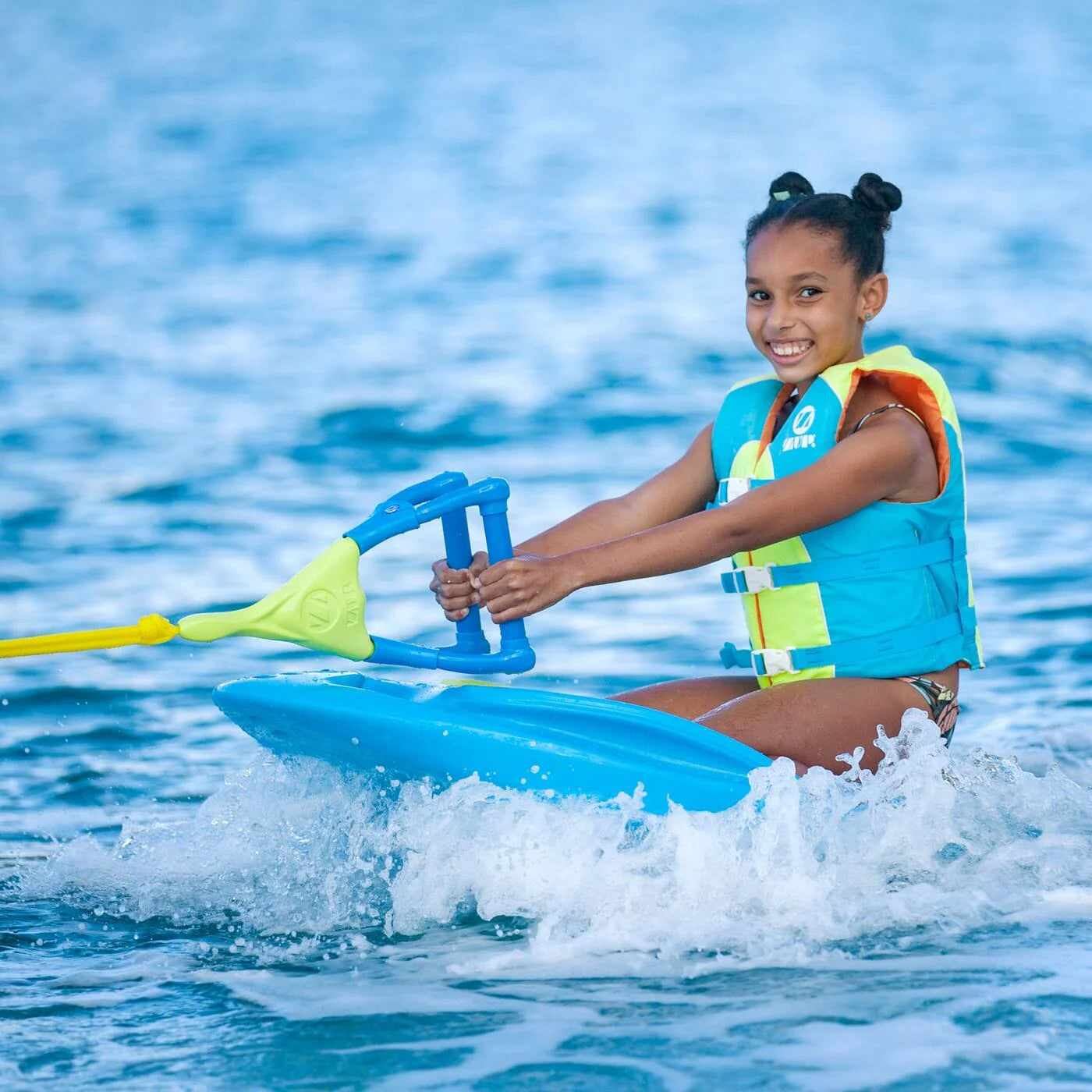 Girl on the ZUP Coast 80 Multi-Sport Board for Kids on a body of water.