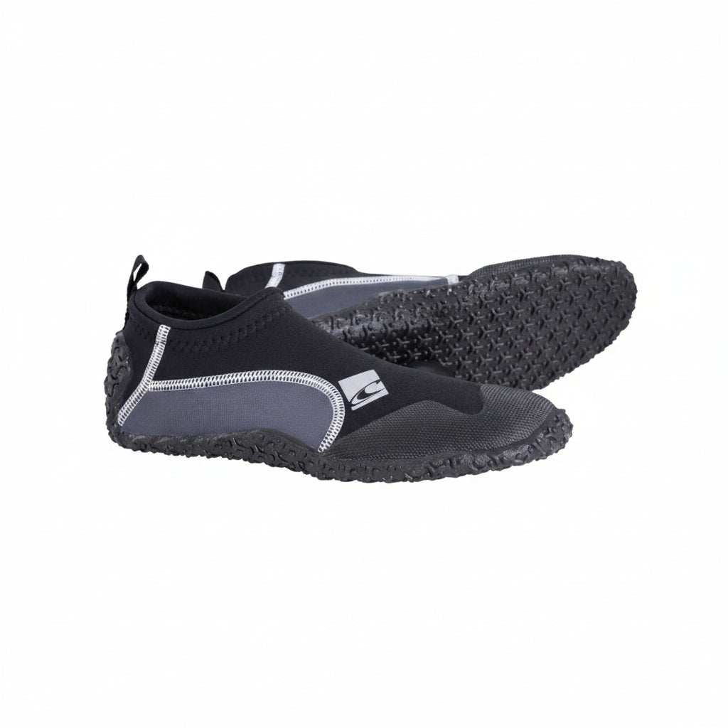 A pair of O'Neill Reactor Reef water shoes with black and gray colors featuring a slip-on design with rubber soles and stitching details for breathability.
